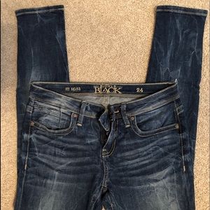 buckle black mid rise skinny jean